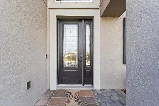 a kitchen with white cabinets and a stove