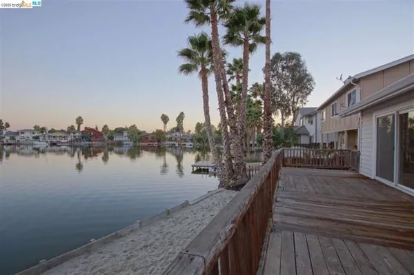a view of a lake with a house and outdoor space