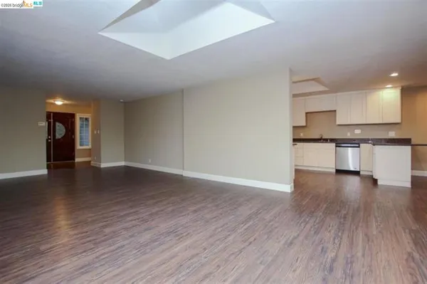 a view of a kitchen with a sink and a stove