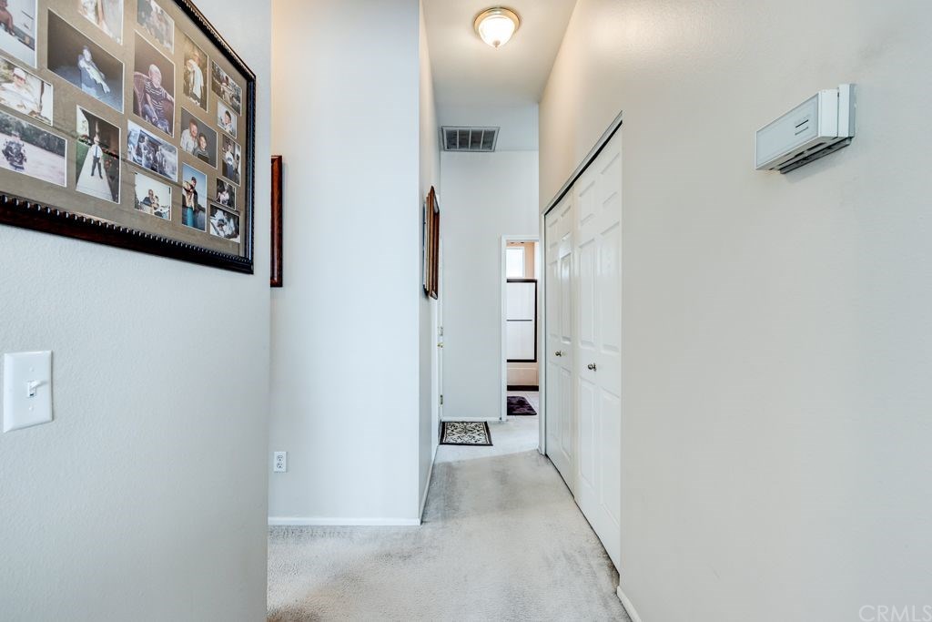 7858 Cameron Way Riverside, CA 92509 - Photo 16 of 40 Hallway to bedrooms and bathrooms offers a nice sized closet for your washer/dryer. Inside is always nice!