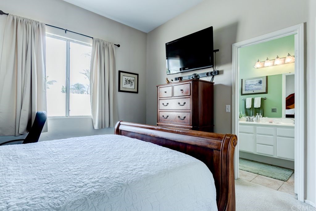 7858 Cameron Way Riverside, CA 92509 - Photo 21 of 40 Main bedroom offers attached bathroom.