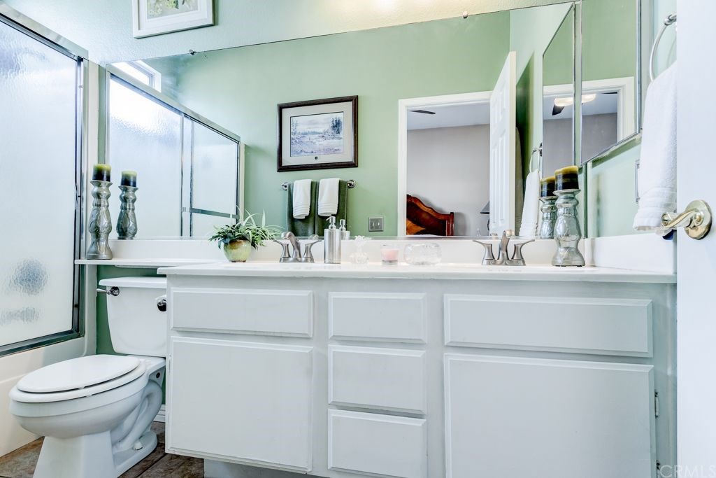 7858 Cameron Way Riverside, CA 92509 - Photo 22 of 40 Main room's attached bathroom is nice in size and offers double-sinks.