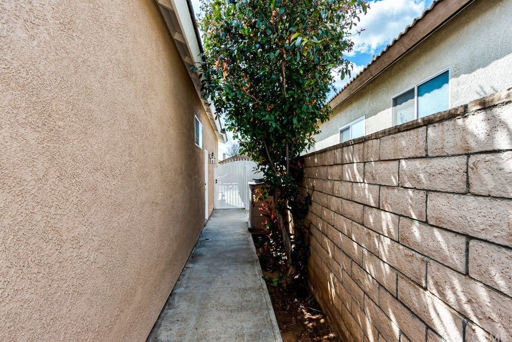7858 Cameron Way Riverside, CA 92509 - Photo 28 of 40 Nice concrete walkway from front yard to backyard.