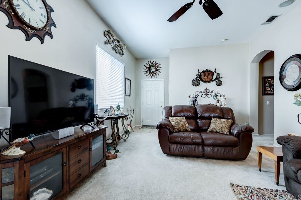 7858 Cameron Way Riverside, CA 92509 - Photo 6 of 40 The front door opens into a living room "open to kitchen" design.