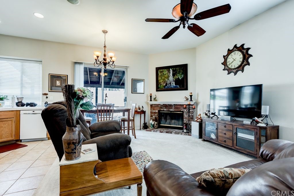 7858 Cameron Way Riverside, CA 92509 - Photo 7 of 40 Living room has a cozy wood burning fireplace.