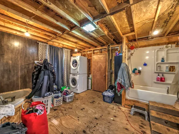 a view of a garage with cars and other table