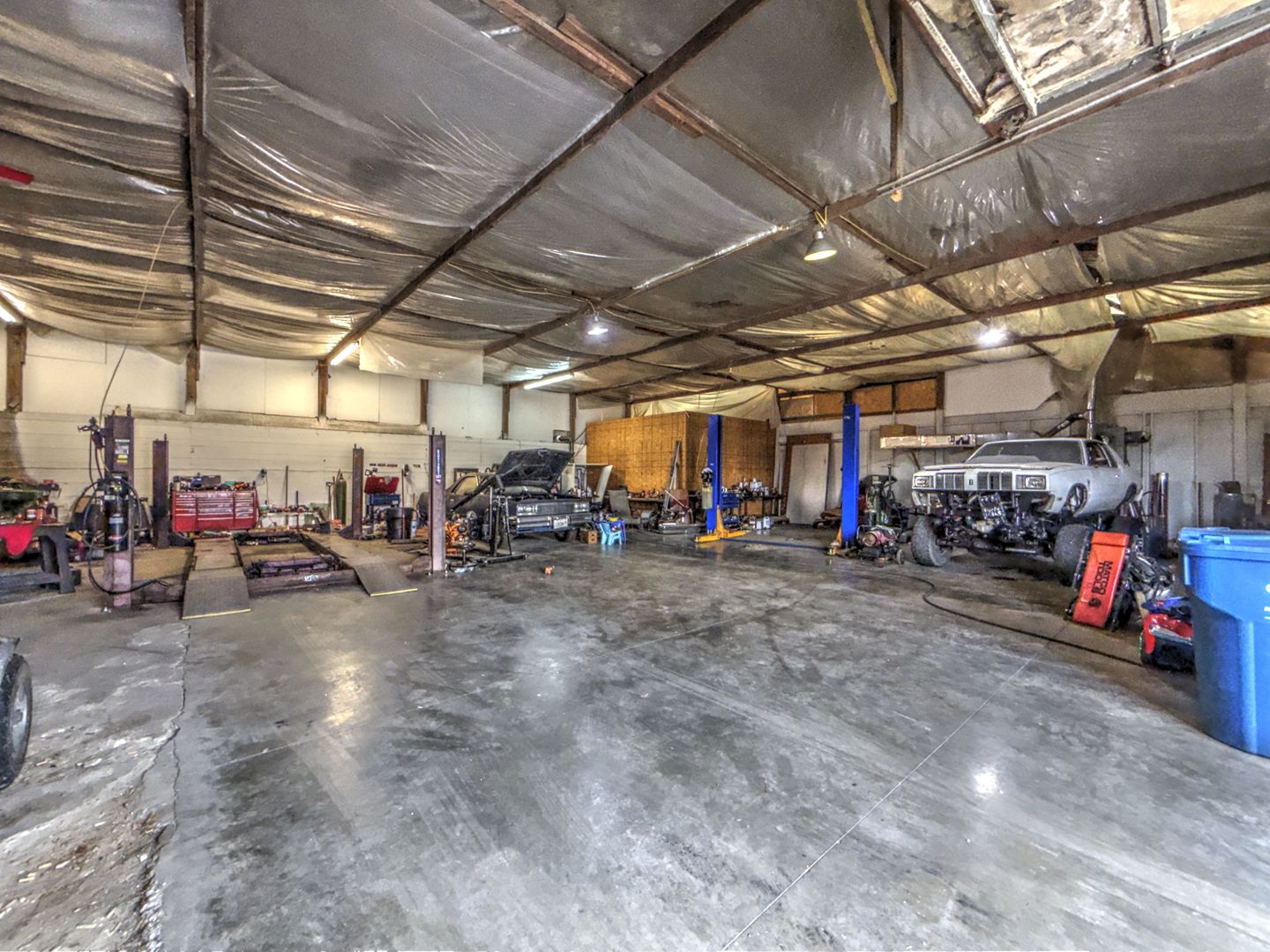 210 Hamilton Street Wellington, IL 60973 - Photo 18 of 21 a view of a garage with cars and other table