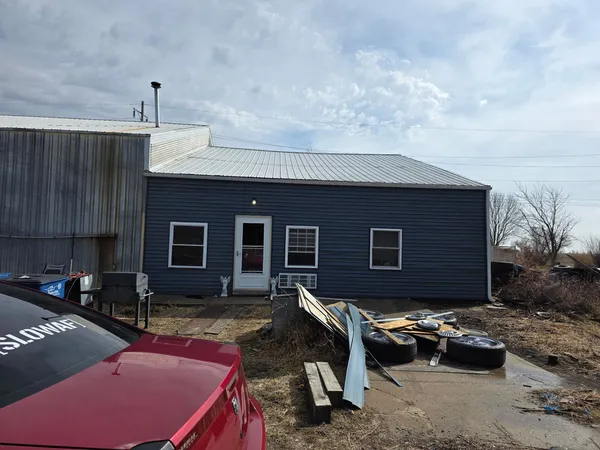 a backyard of a house with yard fire pit barbeque oven and outdoor seating