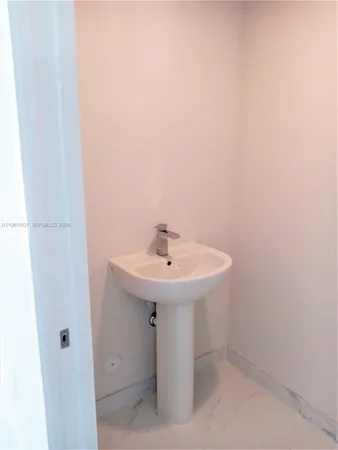 a bathroom with a sink and mirror