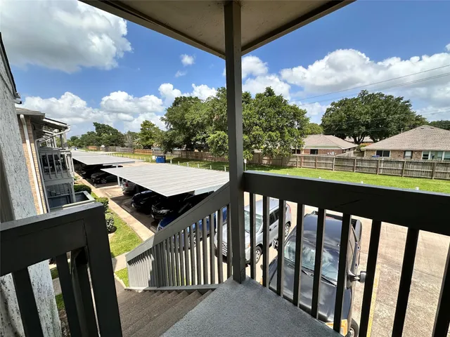 a view of a balcony with city view