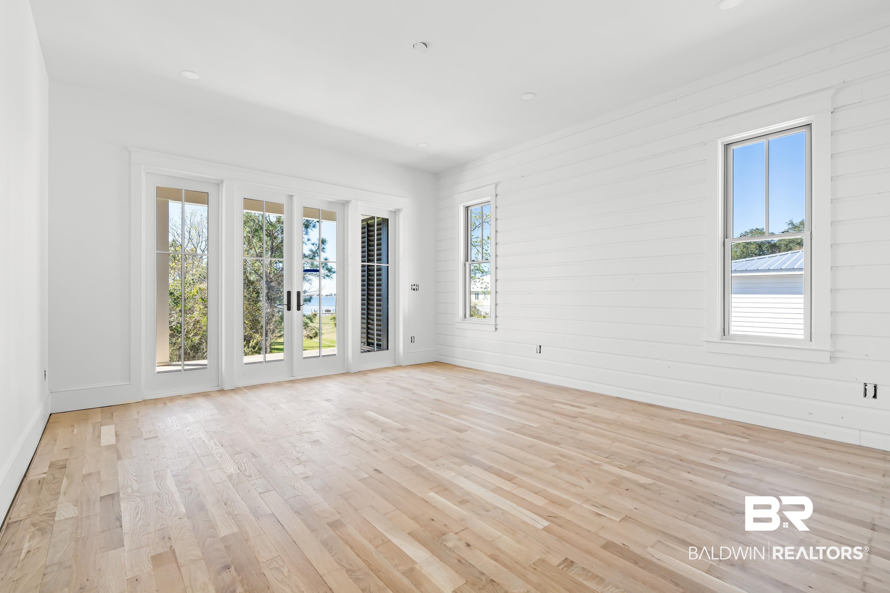 14686 State Highway Gulf Shores, AL 36542 - Photo 17 of 44 Unfurnished room featuring light wood-style floors and recessed lighting