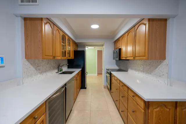 a large kitchen with a large window