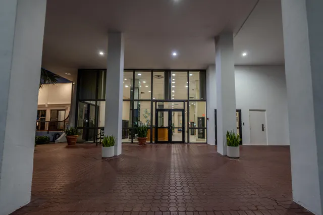 a view of an entryway with wooden floor