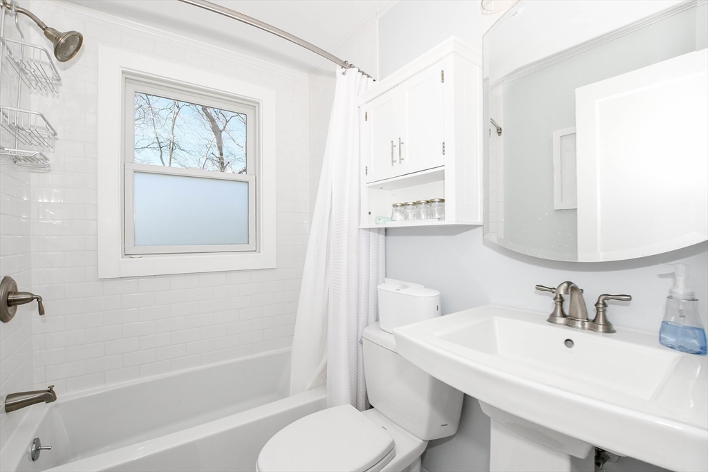 54 Converse Road Marion, MA 02738 - Photo 18 of 36 a bathroom with a toilet a sink and a bath tub