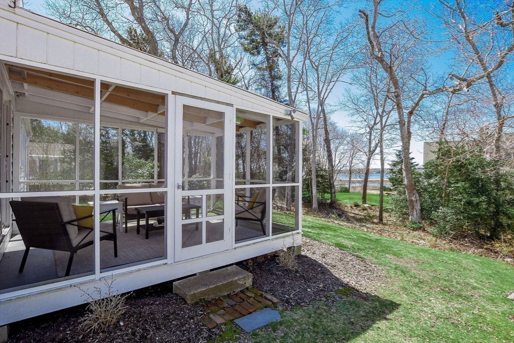54 Converse Road Marion, MA 02738 - Photo 29 of 36 a view of a house with backyard and sitting area