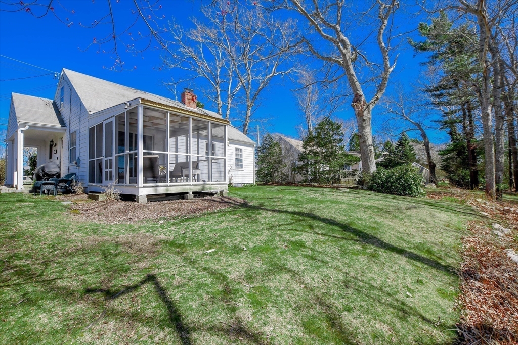 54 Converse Road Marion, MA 02738 - Photo 35 of 36 a view of a house with backyard and trees