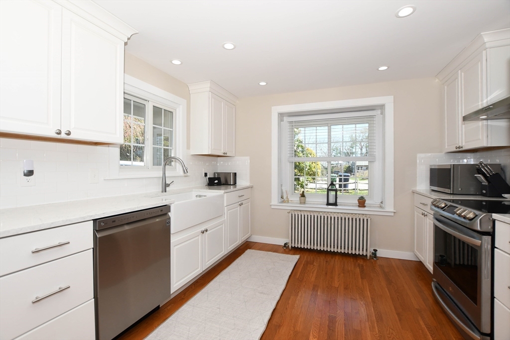 54 Converse Road Marion, MA 02738 - Photo 6 of 36 a kitchen with wooden floors and white appliances