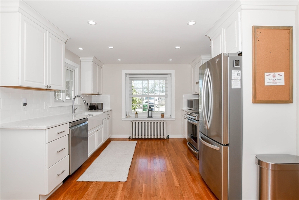 54 Converse Road Marion, MA 02738 - Photo 7 of 36 a kitchen with stainless steel appliances a refrigerator sink and wooden floor