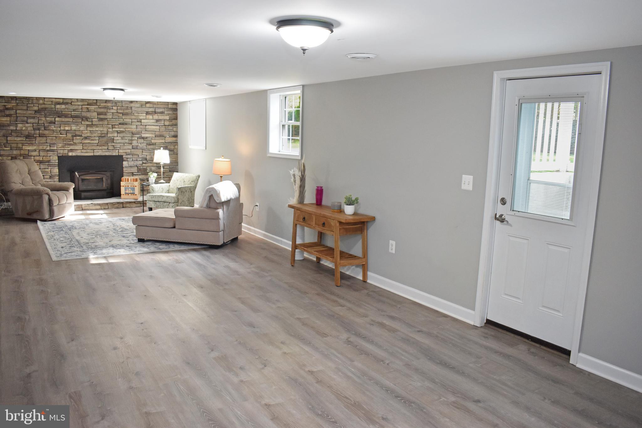 633 Burley Road Annapolis, MD 21409 - Photo 26 of 43 Floor to Ceiling Stone Wall Fireplace