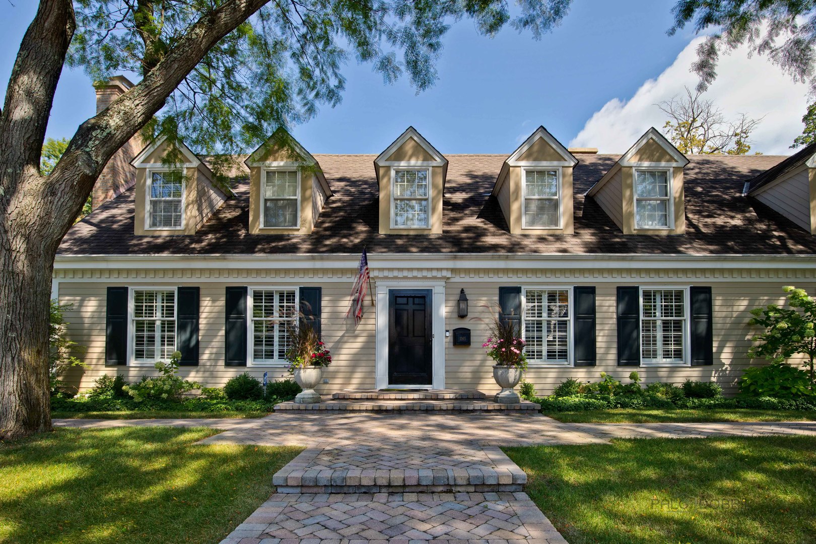 front view of a house with a yard
