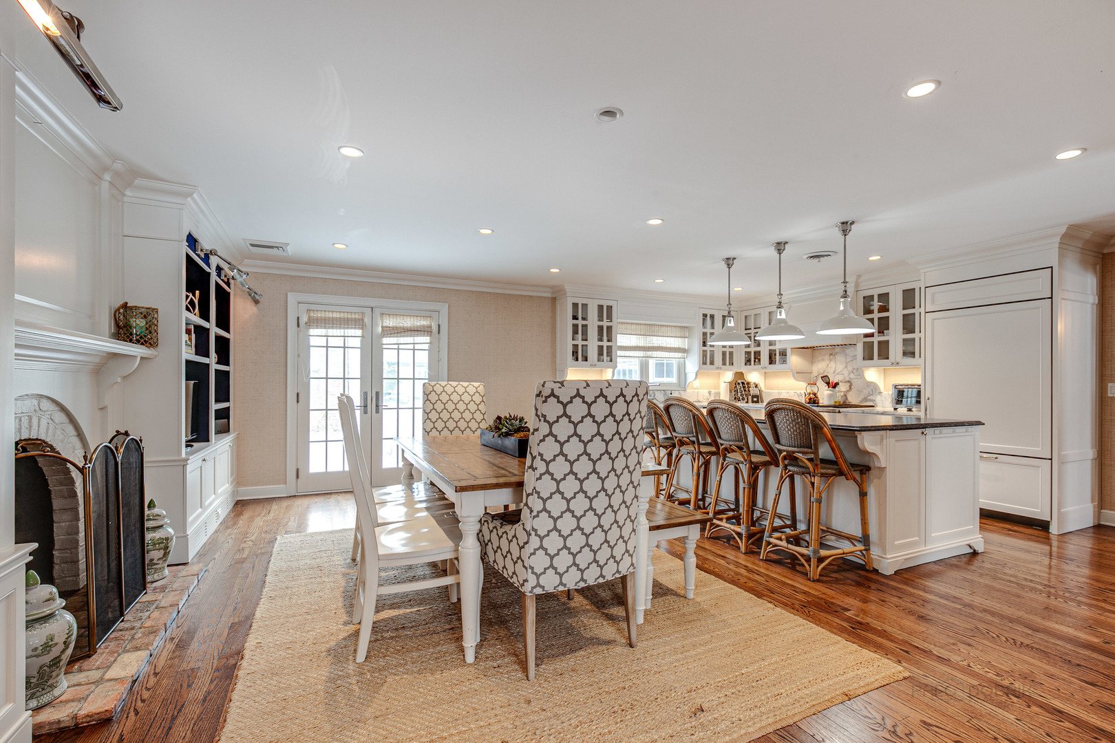 Undisclosed Address Lake Forest, IL 60045 - Photo 12 of 50 a living room with furniture a fireplace and a kitchen view