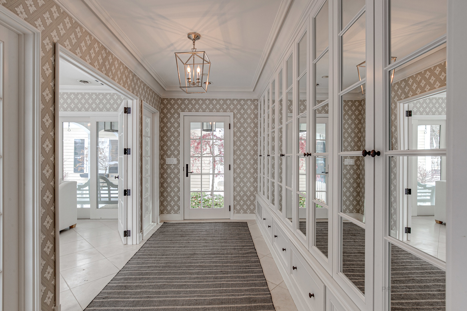 Undisclosed Address Lake Forest, IL 60045 - Photo 15 of 50 a view of a hallway with wooden floor and staircase