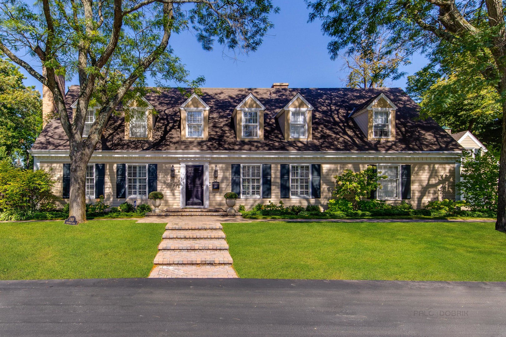 Undisclosed Address Lake Forest, IL 60045 - Photo 2 of 50 a front view of house with yard and green space