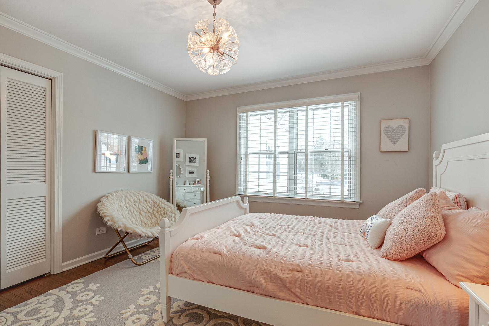 Undisclosed Address Lake Forest, IL 60045 - Photo 28 of 50 a bedroom with a large bed and a chandelier