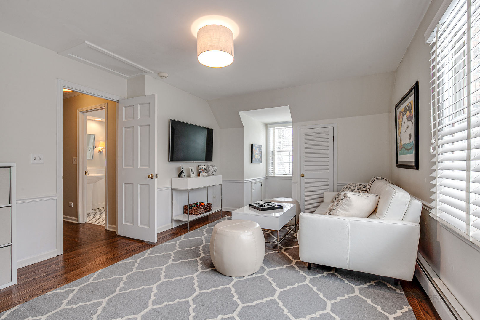 Undisclosed Address Lake Forest, IL 60045 - Photo 30 of 50 a living room with furniture and a flat screen tv