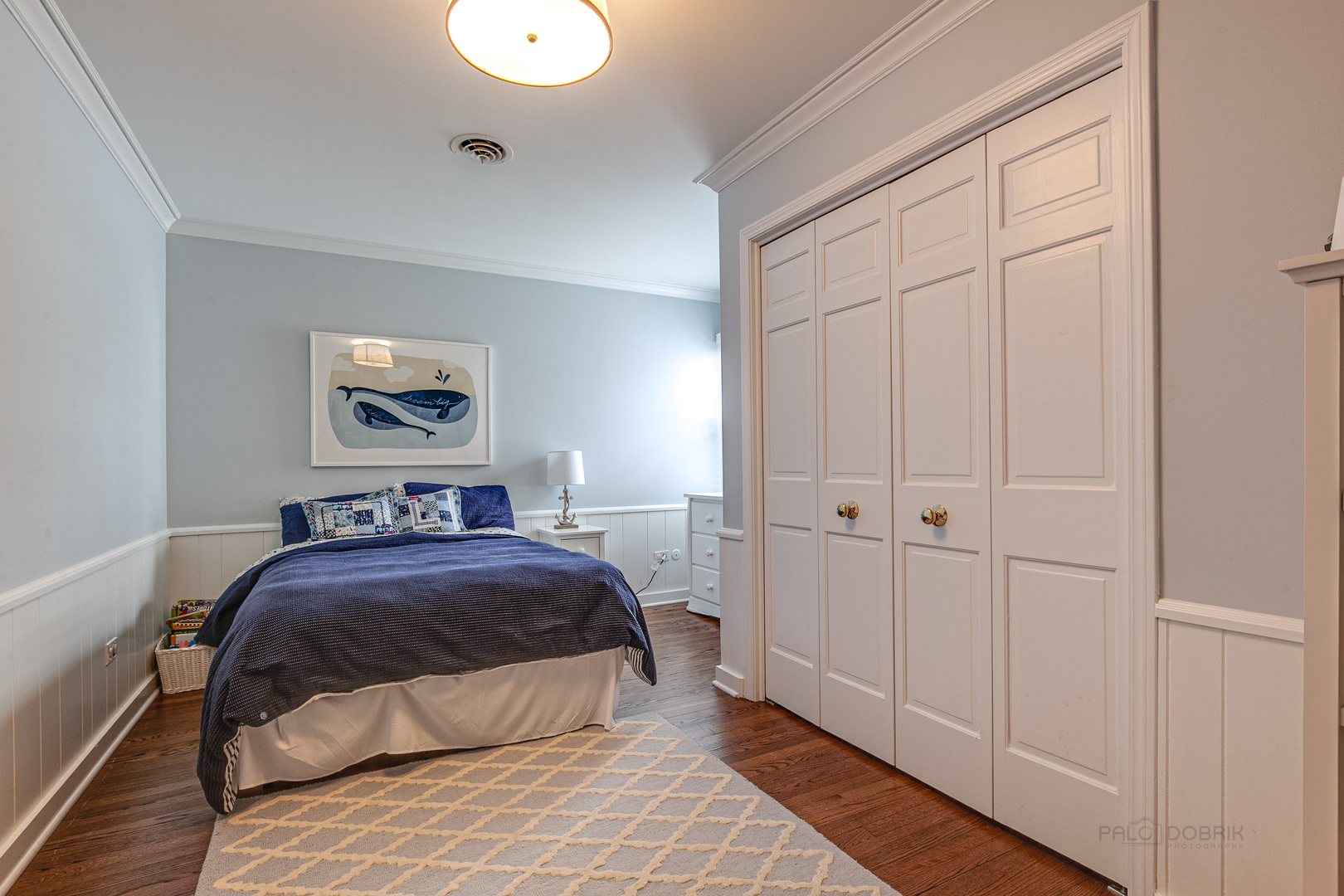 Undisclosed Address Lake Forest, IL 60045 - Photo 31 of 50 a bedroom with a bed and a painting on the wall