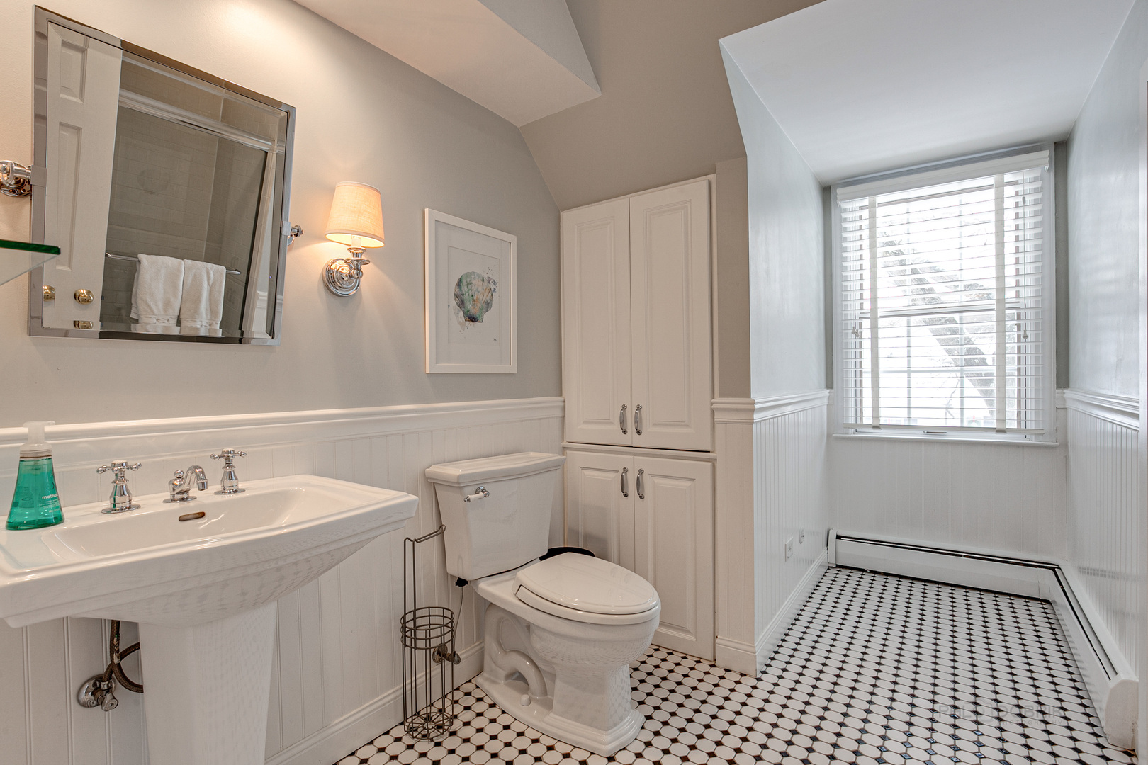 Undisclosed Address Lake Forest, IL 60045 - Photo 32 of 50 a bathroom with a sink a toilet and mirror