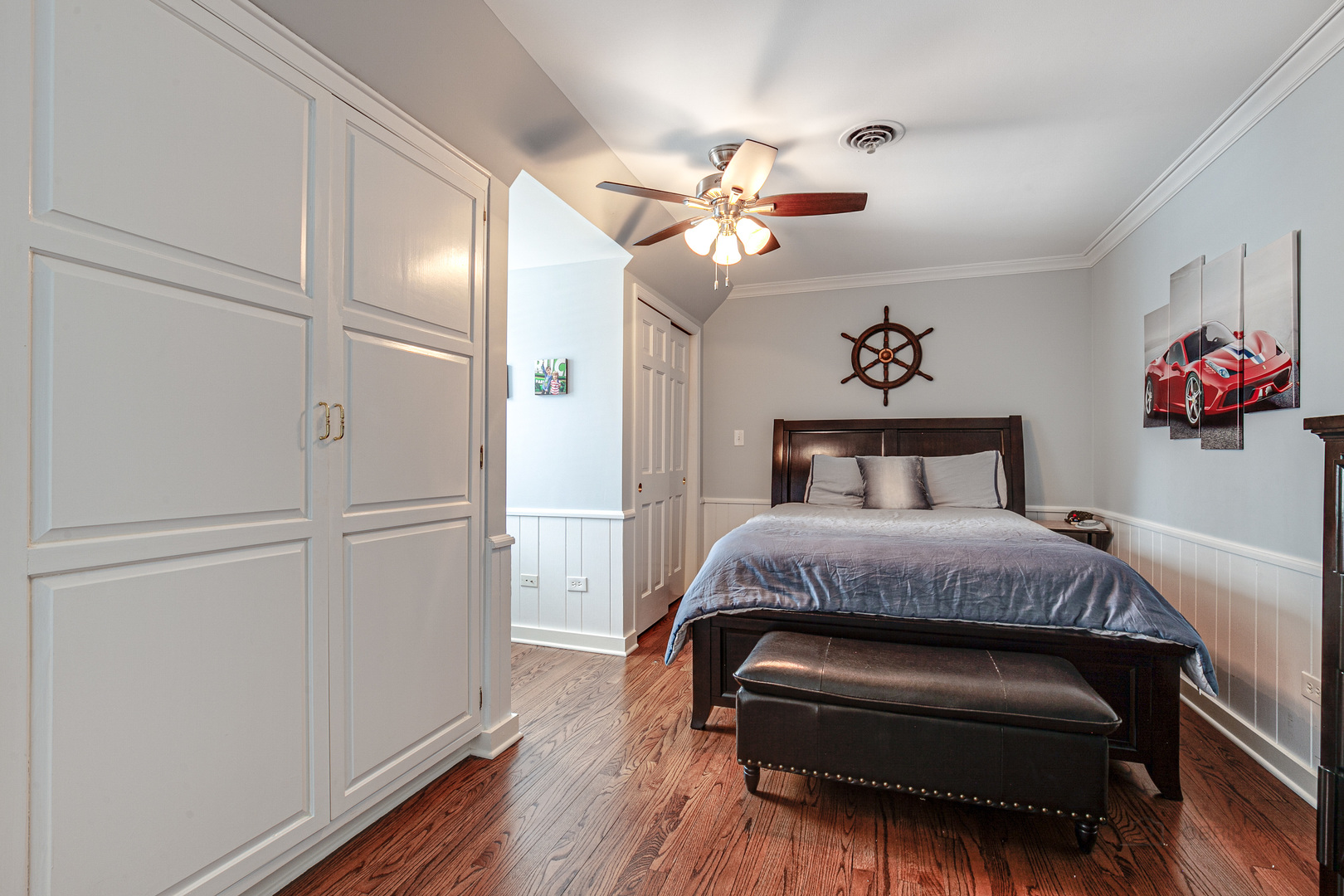 Undisclosed Address Lake Forest, IL 60045 - Photo 33 of 50 a bedroom with a bed and wooden floor