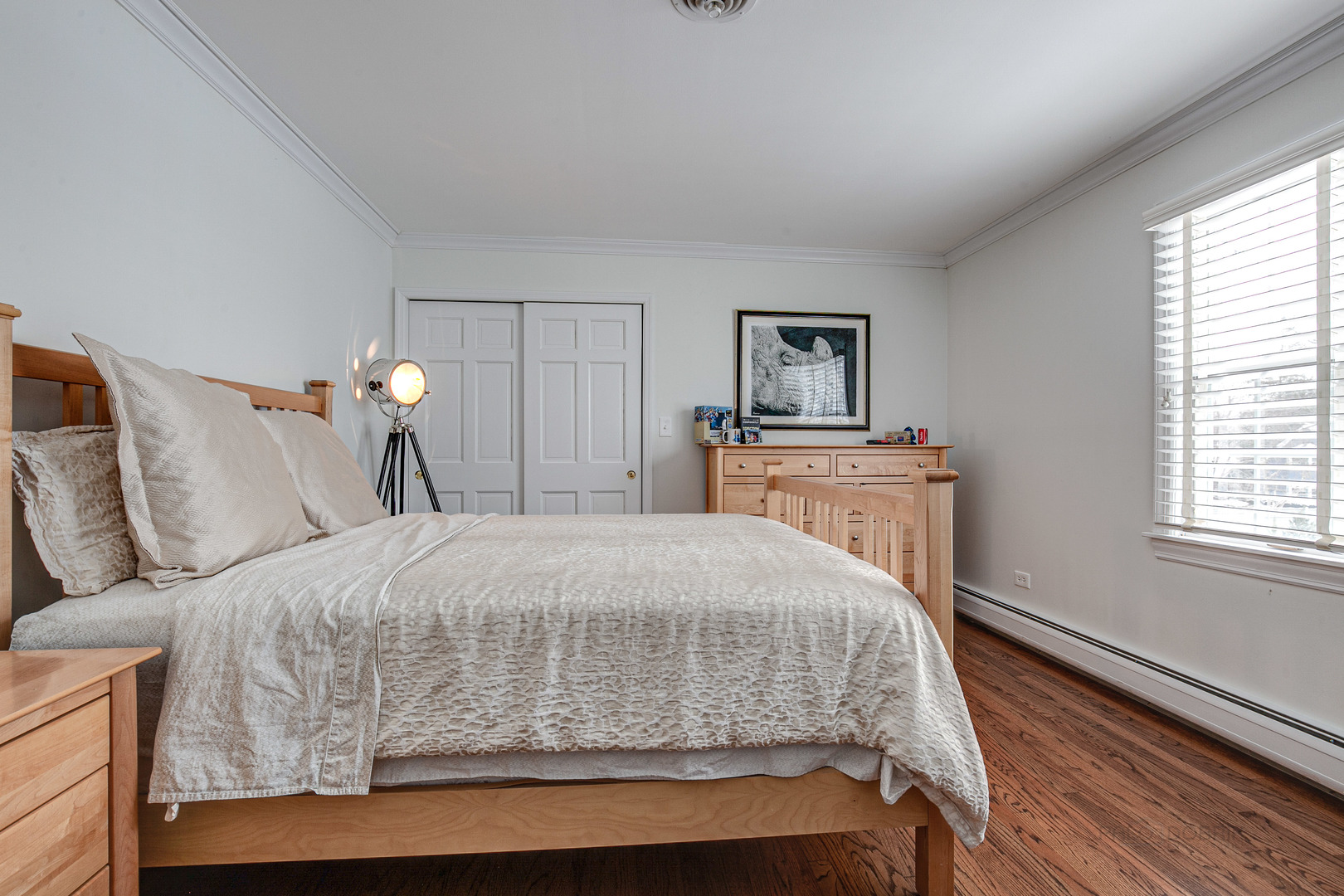 Undisclosed Address Lake Forest, IL 60045 - Photo 34 of 50 a bedroom with a bed and wooden floor