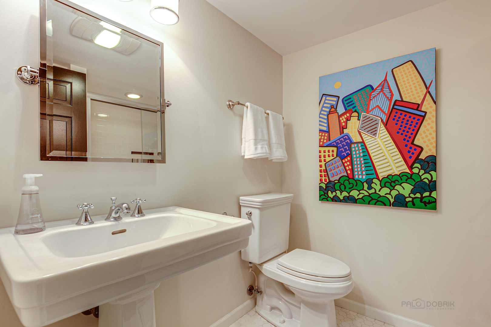 Undisclosed Address Lake Forest, IL 60045 - Photo 38 of 50 a bathroom with a toilet sink and mirror