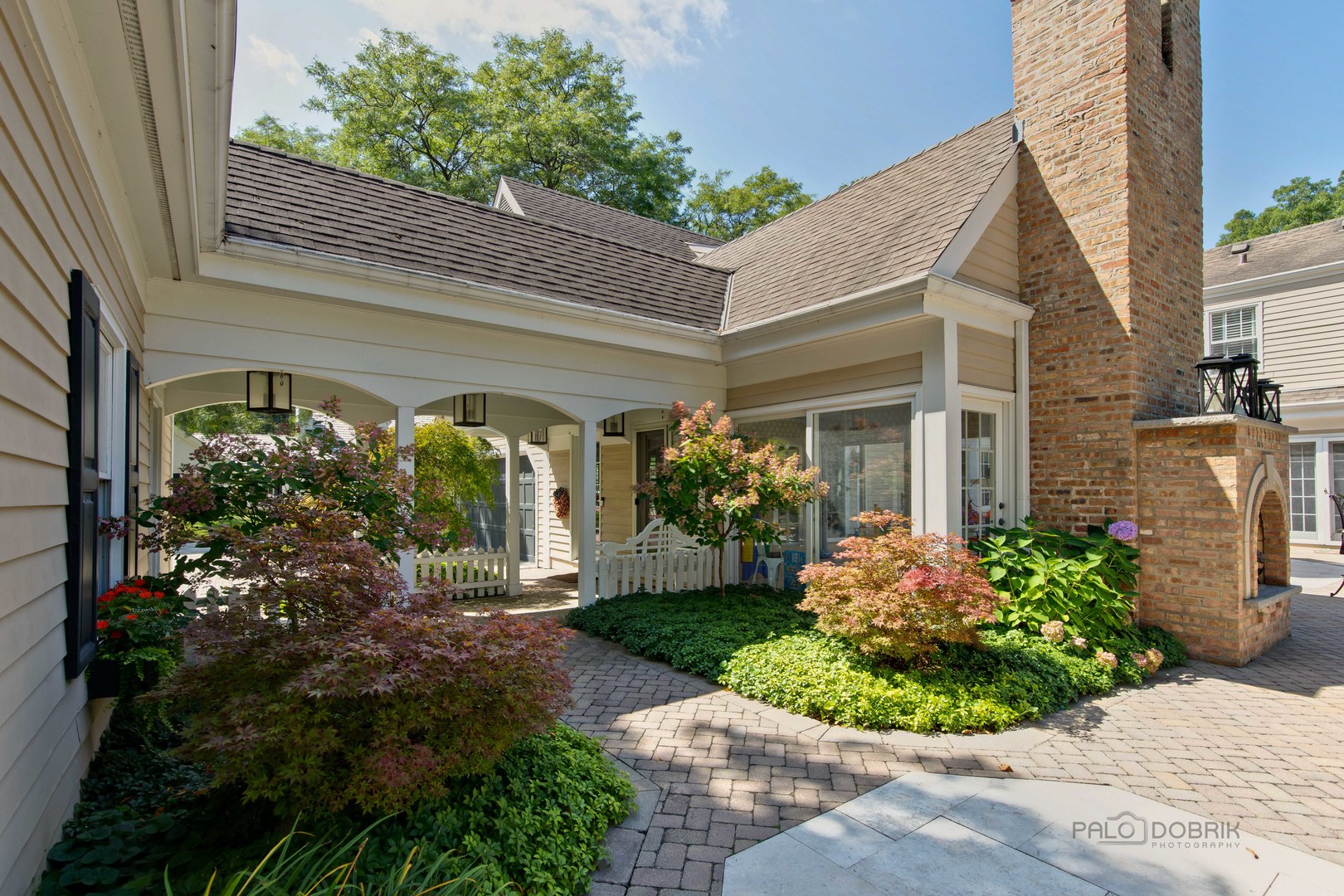 Undisclosed Address Lake Forest, IL 60045 - Photo 43 of 50 a front view of a house with garden