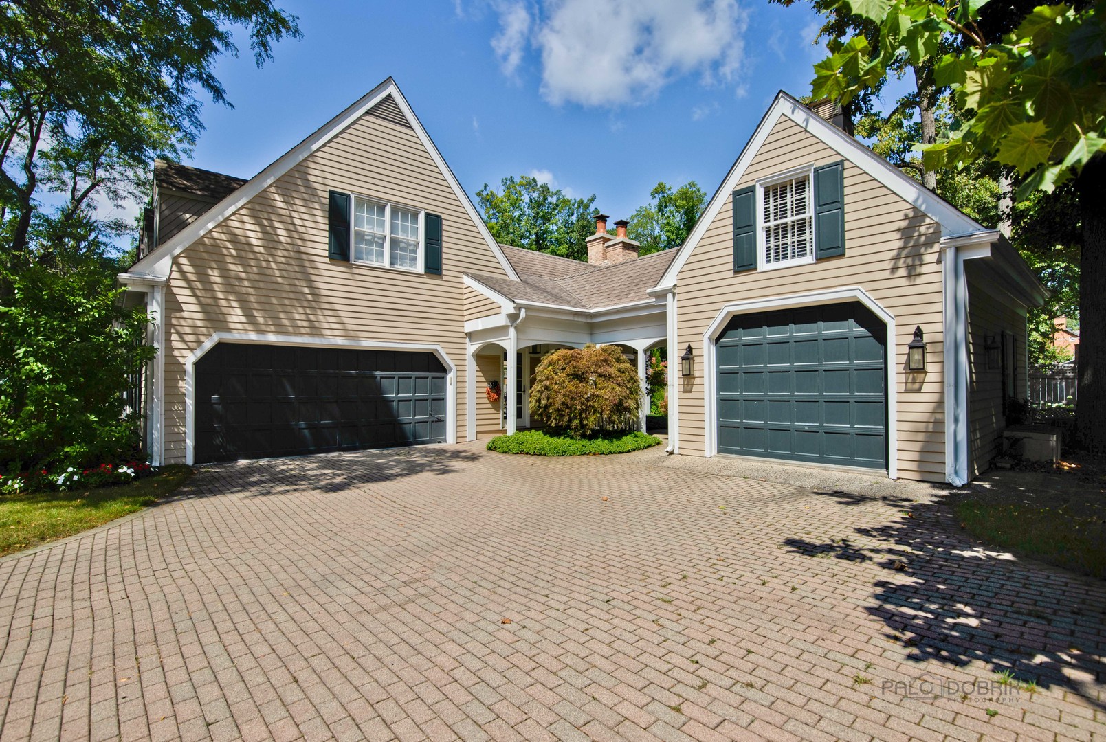 Undisclosed Address Lake Forest, IL 60045 - Photo 50 of 50 a front view of a house with a yard and garage