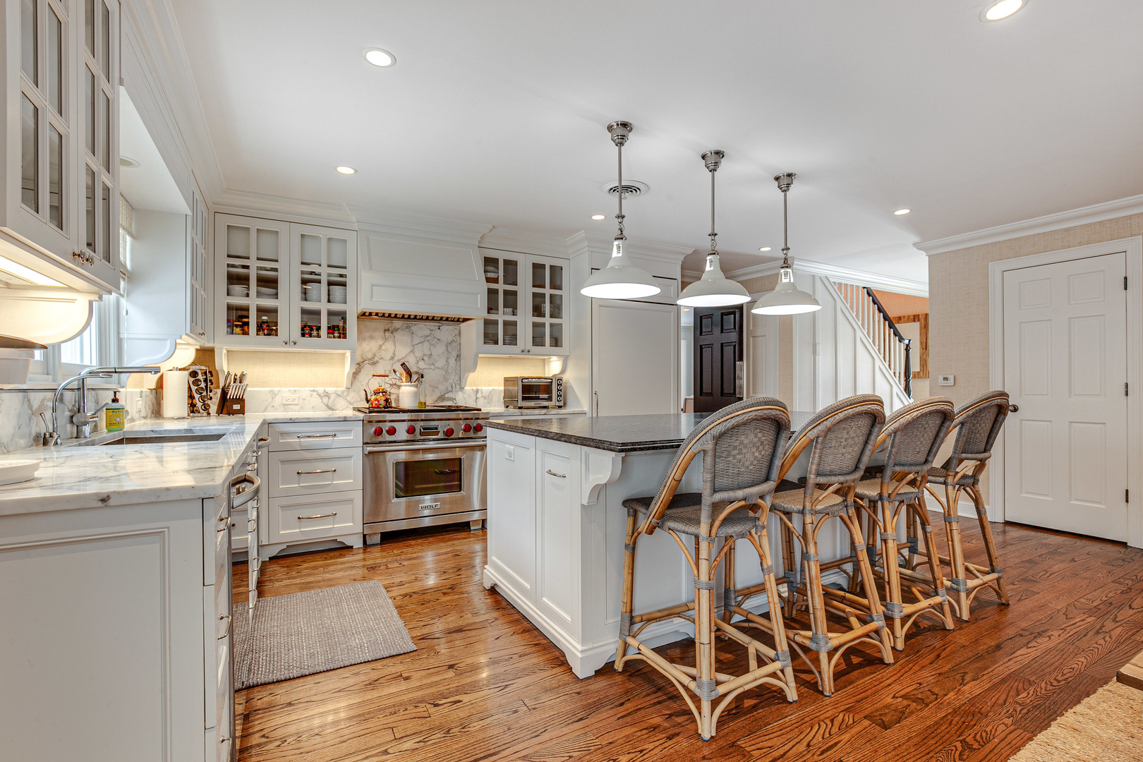 Undisclosed Address Lake Forest, IL 60045 - Photo 9 of 50 a open kitchen with stainless steel appliances granite countertop a stove top oven a sink a counter space and cabinets