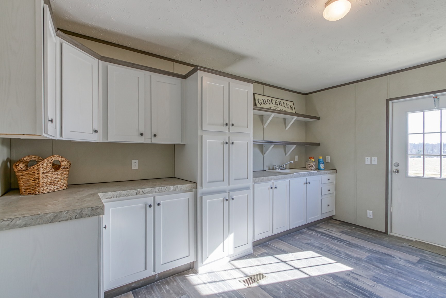 1838 Austin Road Lafayette, TN 37083 - Photo 18 of 41 a kitchen with granite countertop white cabinets and stainless steel appliances