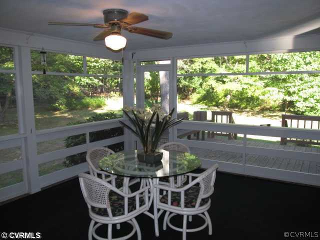 2710 Salisbury Road Midlothian, VA 23113 - Photo 7 of 12 a dining room with furniture a chandelier and wooden floor