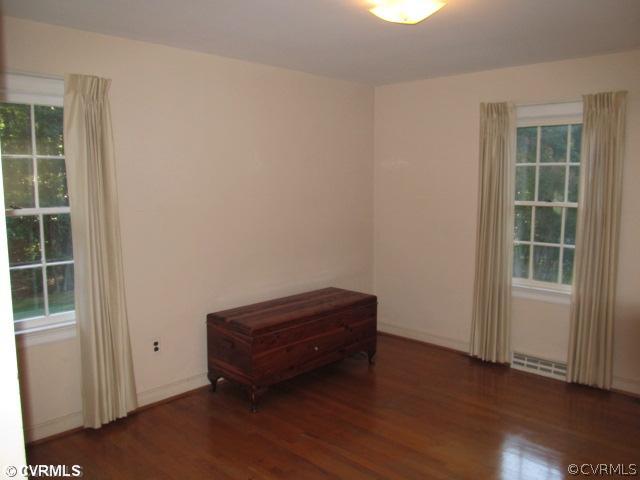 2710 Salisbury Road Midlothian, VA 23113 - Photo 8 of 12 an empty room with wooden floor and windows