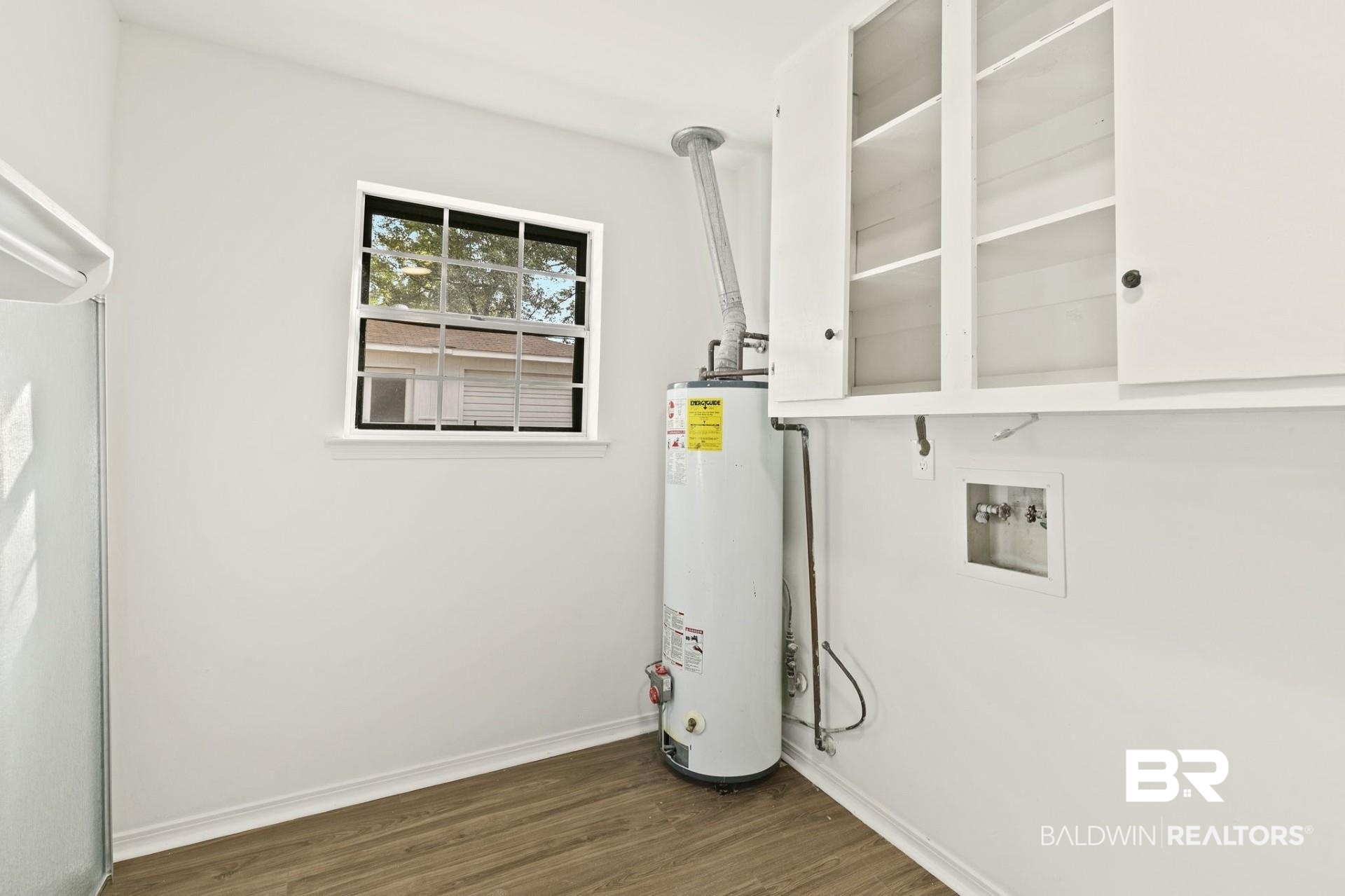 3270 Graham Road North Mobile, AL 36618 - Photo 24 of 54 Clothes washing area with water heater, hookup for a washing machine, and dark hardwood / wood-style flooring