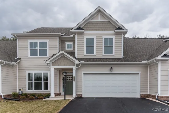 a front view of a house with a garage