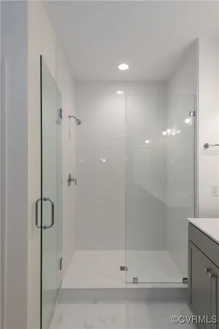 a bathroom with a shower and bathtub