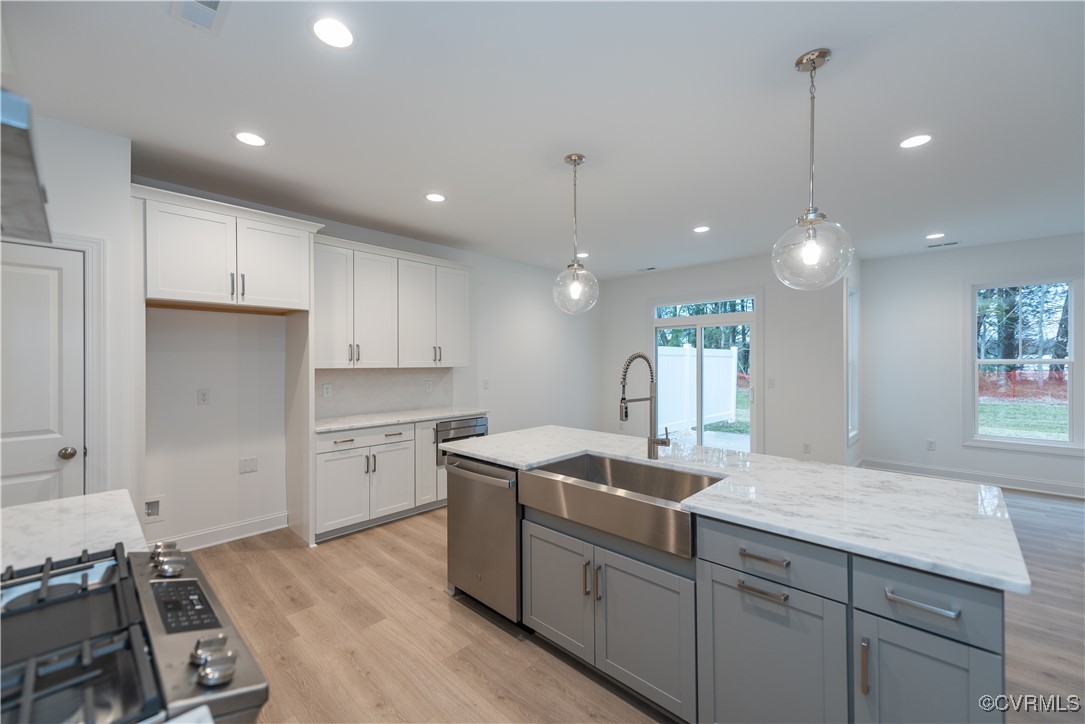 0 Hope Farm Lane Mechanicsville, VA 23111 - Photo 5 of 15 a kitchen with kitchen island a sink stainless steel appliances and cabinets