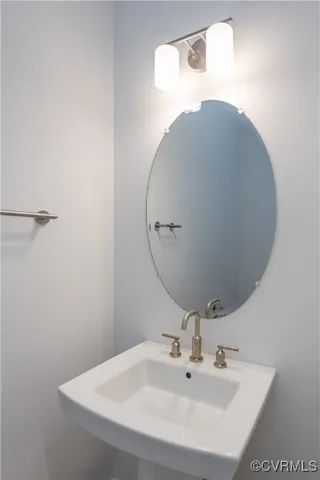 a bathroom with a sink and mirror