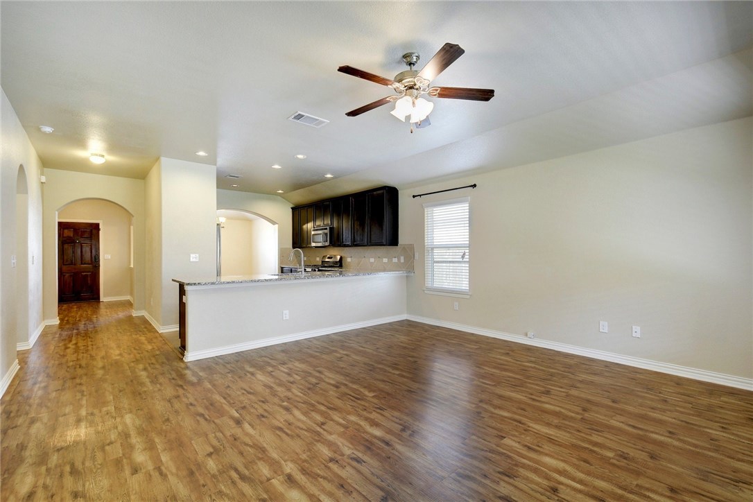 3621 Rams Horn Way Round Rock, TX 78665 - Photo 7 of 24 a view of a kitchen with a sink and a window