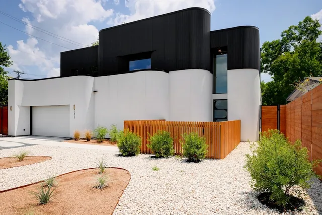 a view of a backyard of the house