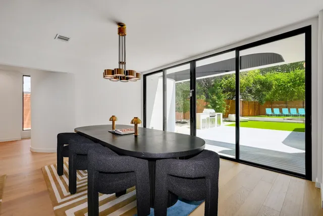 a bathroom with double vanity sinks and a mirror