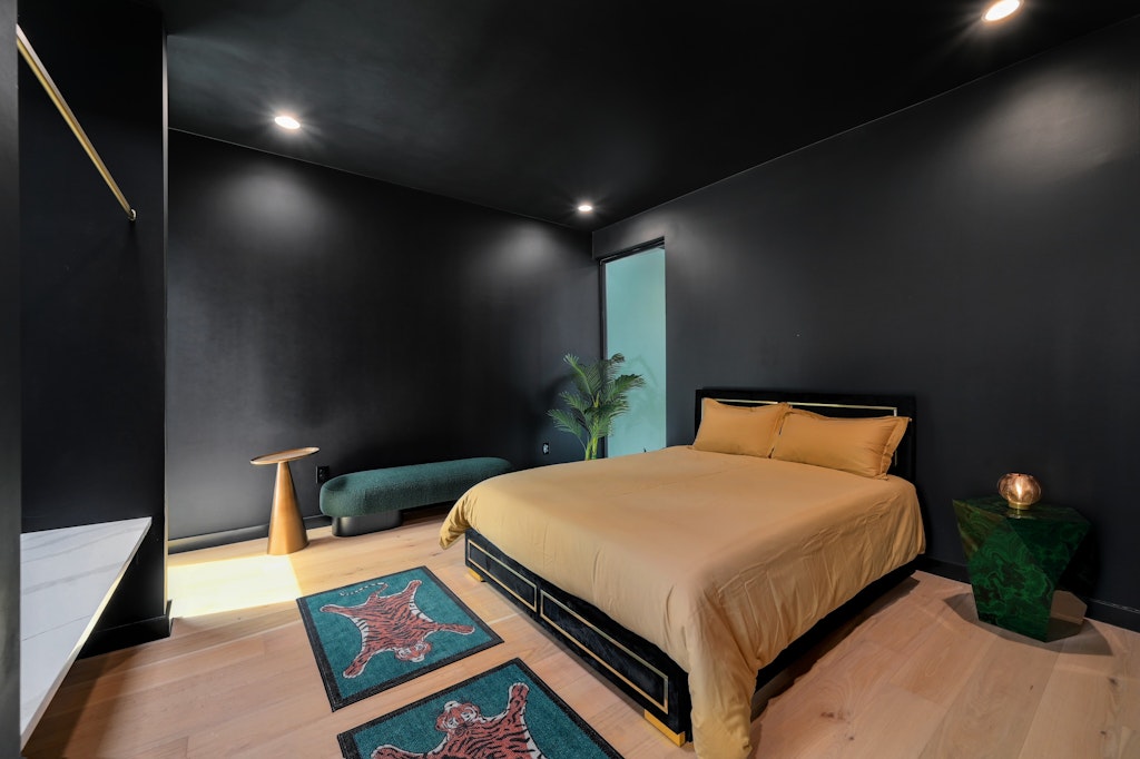 7809 Woodrow Avenue Austin, TX 78757 - Photo 23 of 40 a bed room with a bed and a night stand