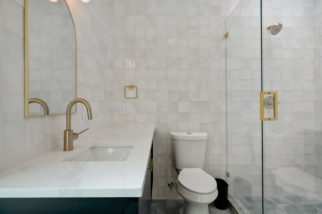7809 Woodrow Avenue Austin, TX 78757 - Photo 25 of 40 a bathroom with a sink and a toilet